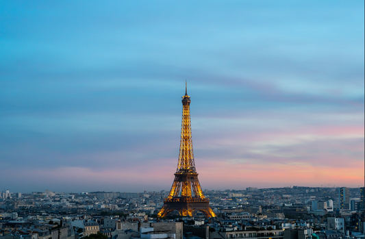 Dreaming sunset time of The Eiffel Tower with the nearby city.